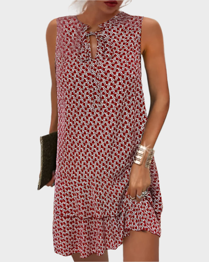 Vestido Mini com Padrão e Detalhe de Laço no Pescoço