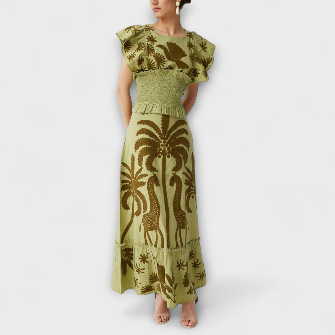 Top estiloso com design de palmeira e aves tropicais