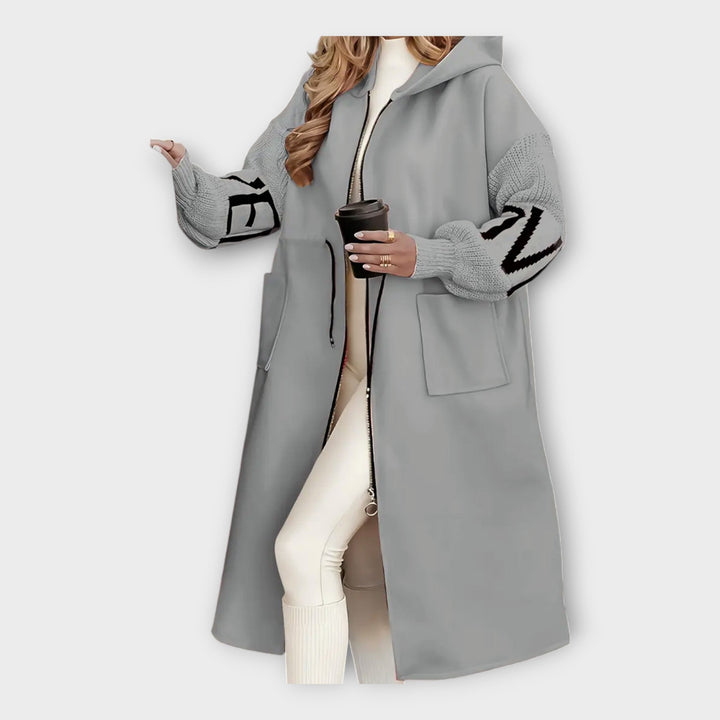 Casaco Longo Elegante com Detalhes Modernos