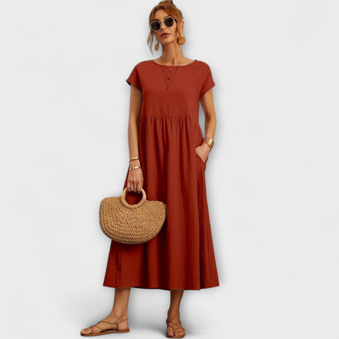 Vestido Midi com Linha Simples e Bolsos Laterais