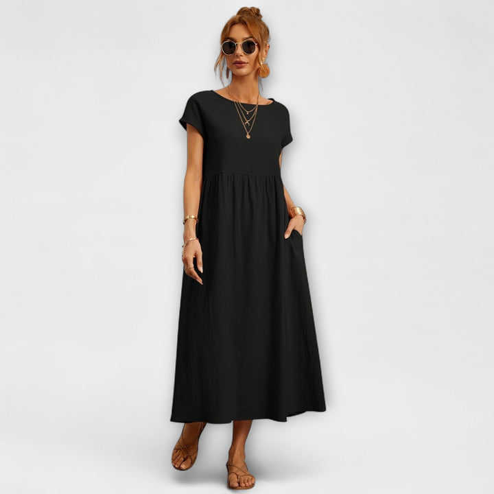 Vestido Midi com Linha Simples e Bolsos Laterais