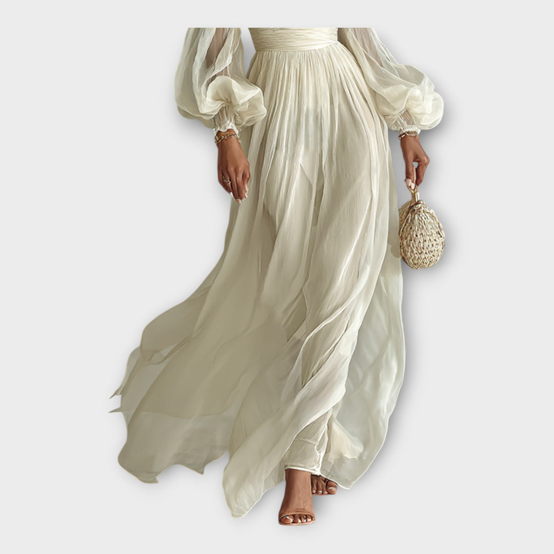Vestido maxi arejado com linha romântica