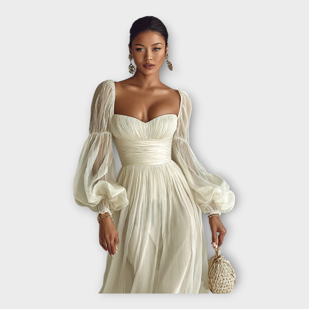 Vestido maxi arejado com linha romântica