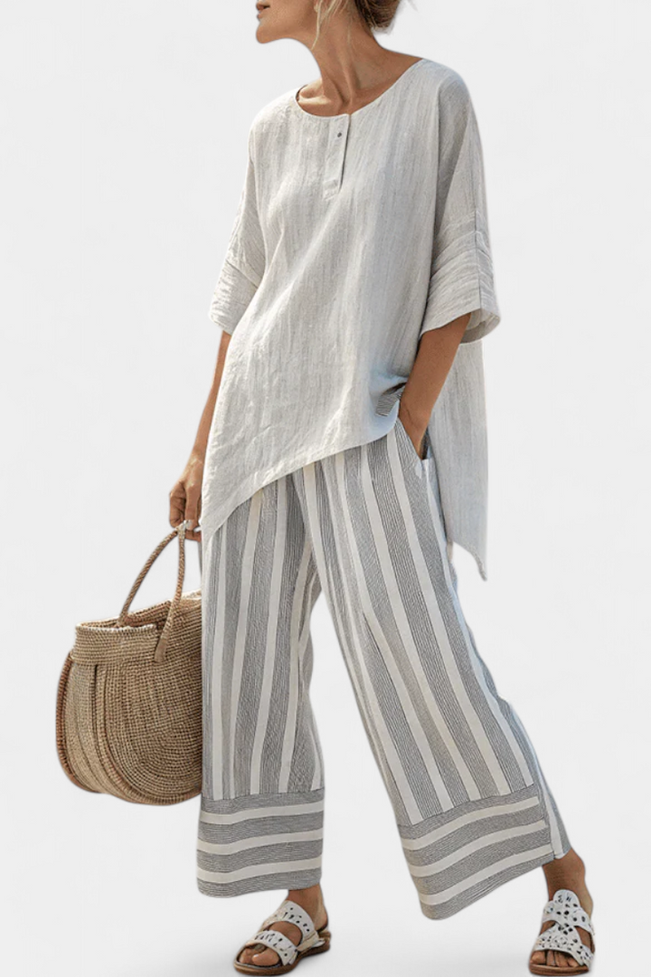 Conjunto Daisy com Blusa Assimétrica e Calças Listradas para um Estilo Moderno e Elegante