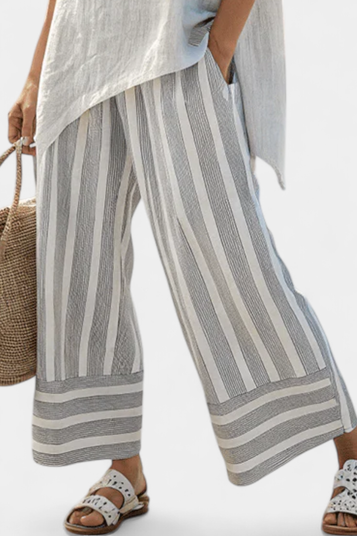 Conjunto Daisy com Blusa Assimétrica e Calças Listradas para um Estilo Moderno e Elegante