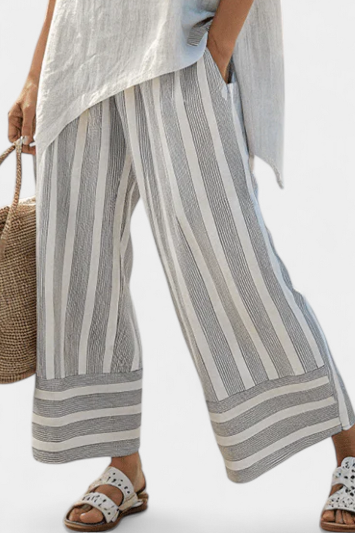 Conjunto Daisy com Blusa Assimétrica e Calças Listradas para um Estilo Moderno e Elegante